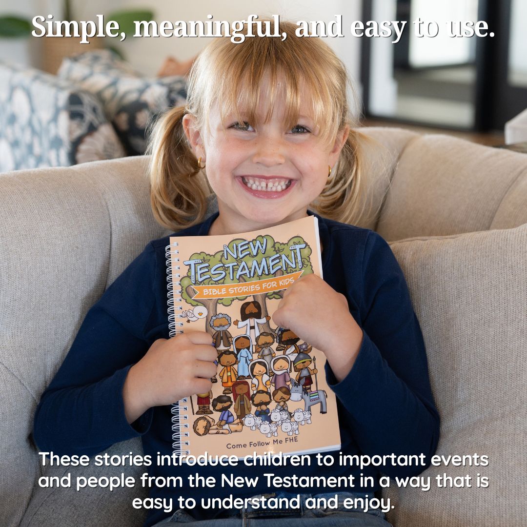 Child holding the New Testament Bible Stories for Kids book and smiling.