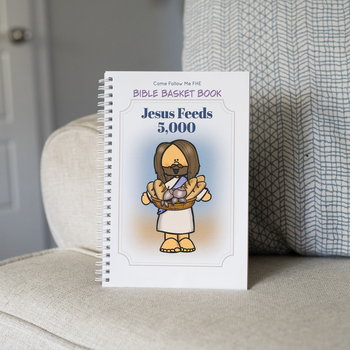 Open title page showing an illustrated New Testament story for children, Jesus Feeds the 5,000.