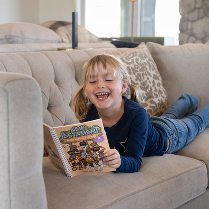 Child reading New Testament Bible Stories for Kids during family scripture study